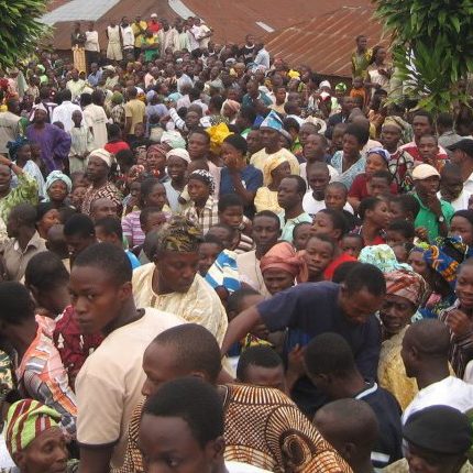Huge crowd of spectators during coronation ceremony, most of them witnessing the process for the first time in their lives